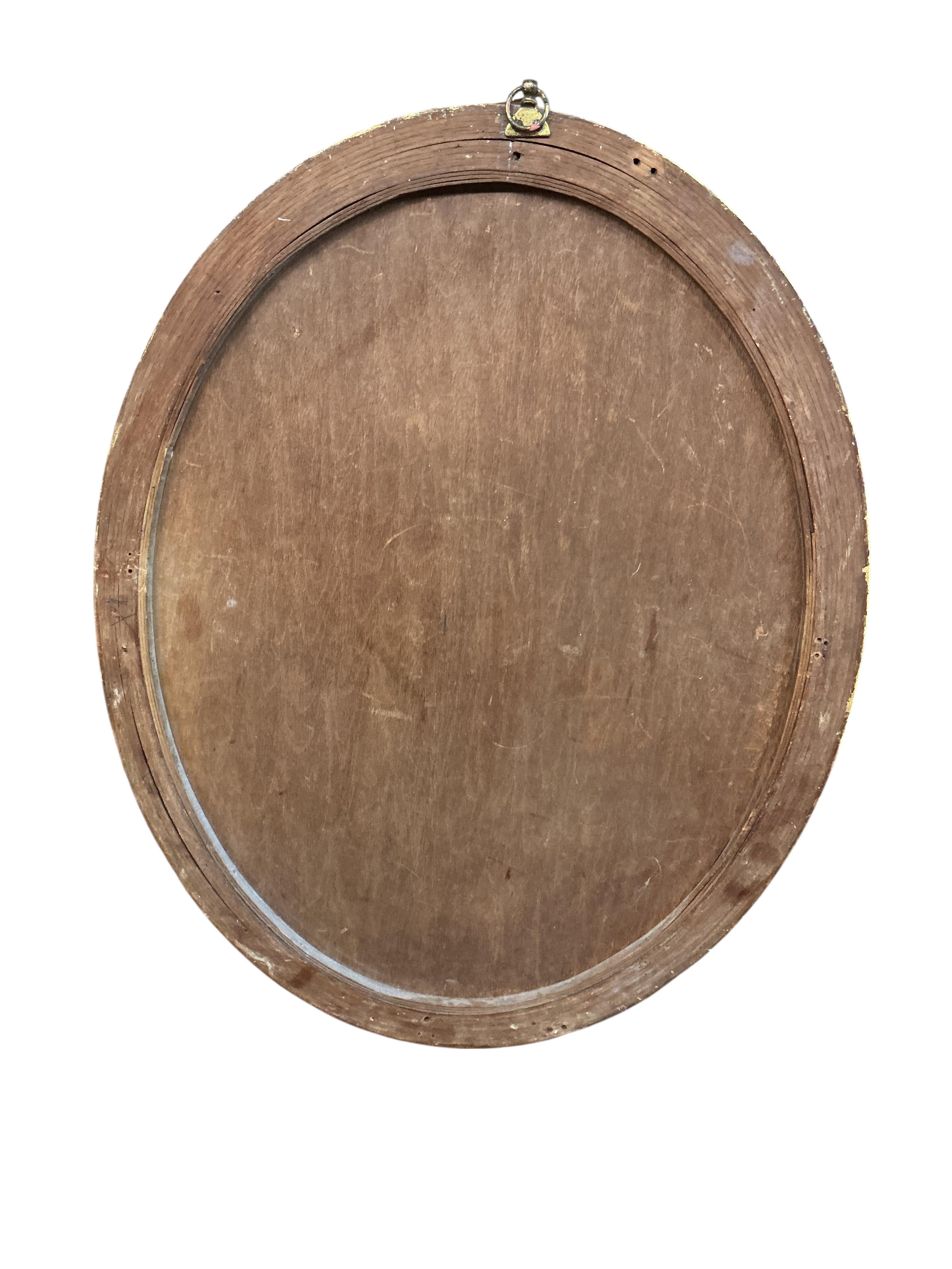 An early 20th century French giltwood and composition circular wall mirror, diameter 51cm, together with an Edwardian oval bevelled mirror and a Regency style wall mirror